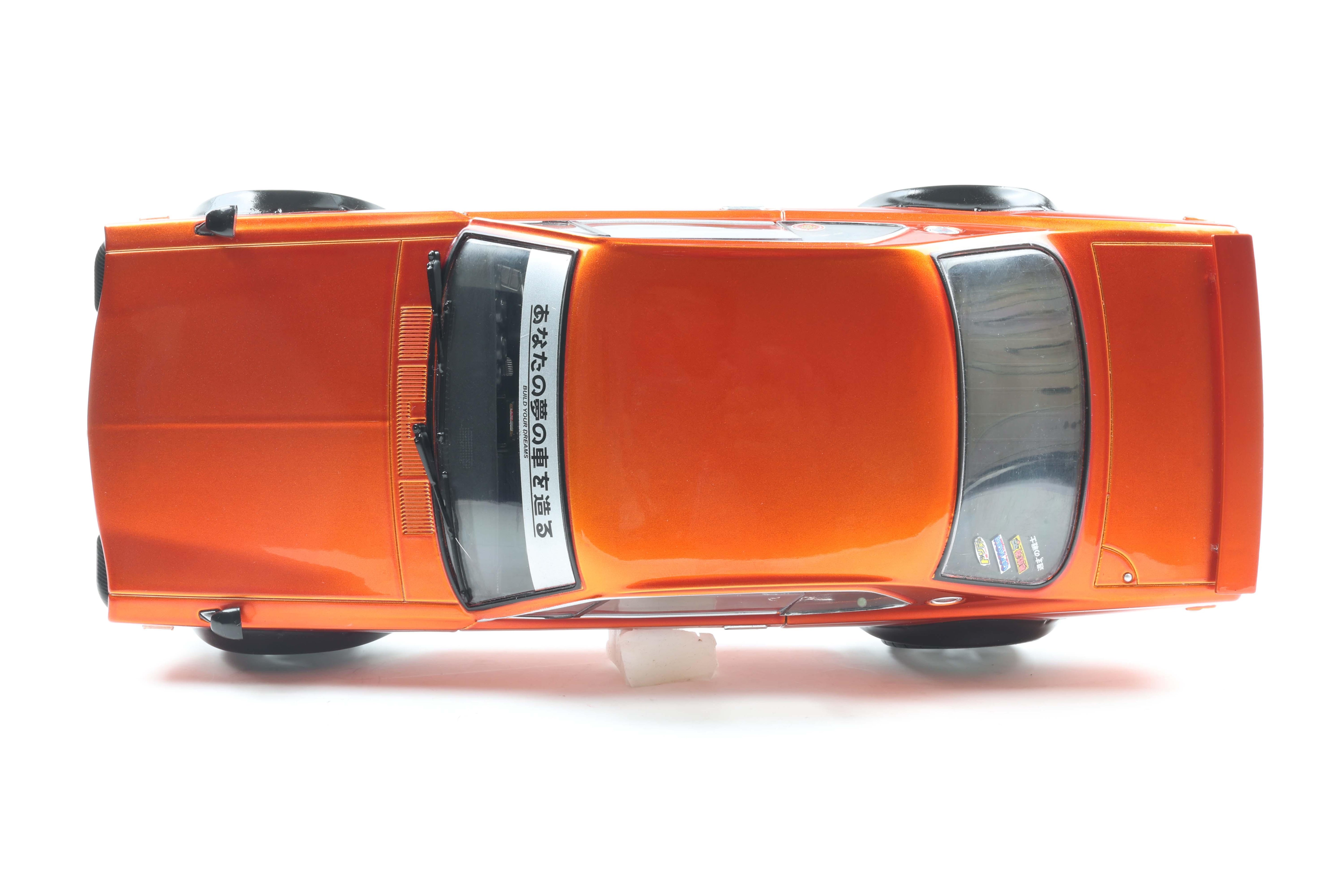 Solido S1813003 Voiture miniature collection 1/18 Nissan Skyline (C10) Hakosuka – orange metallic – 1970